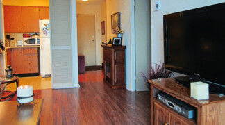 View of one bedroom suite hallway and front door